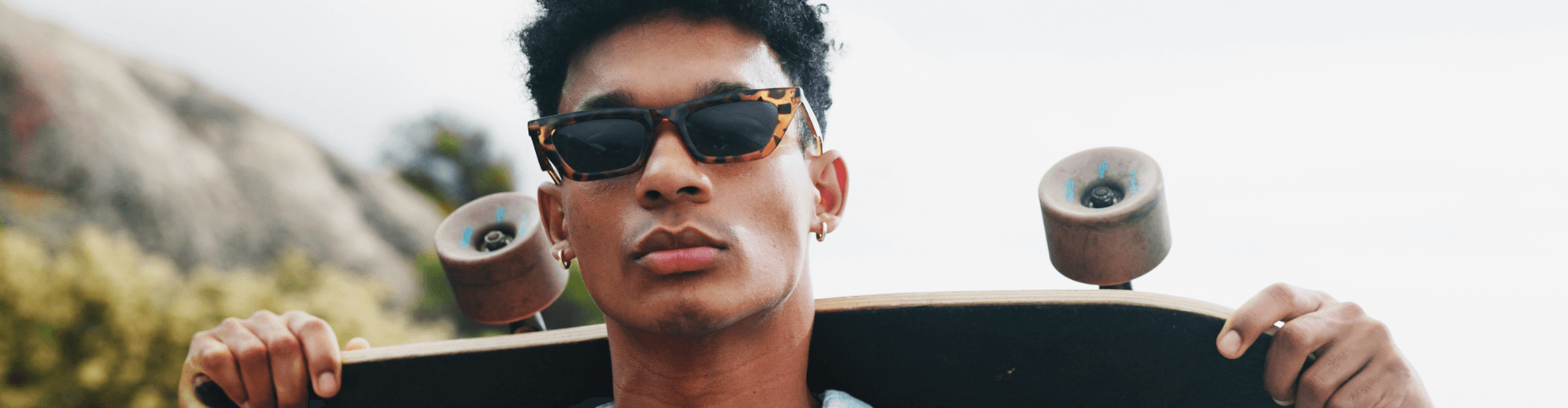 Picture of a young guy wearing sunglasses